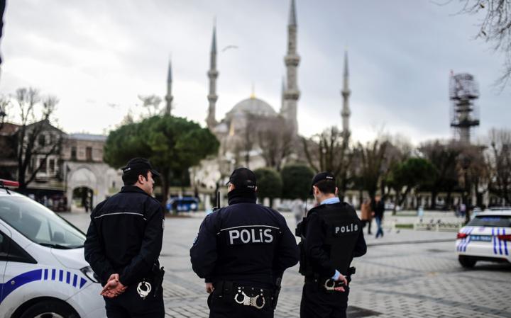Police officers stand guard in front of the Blue Mosque in Istanbul, Turkey. Source: The Telegraph