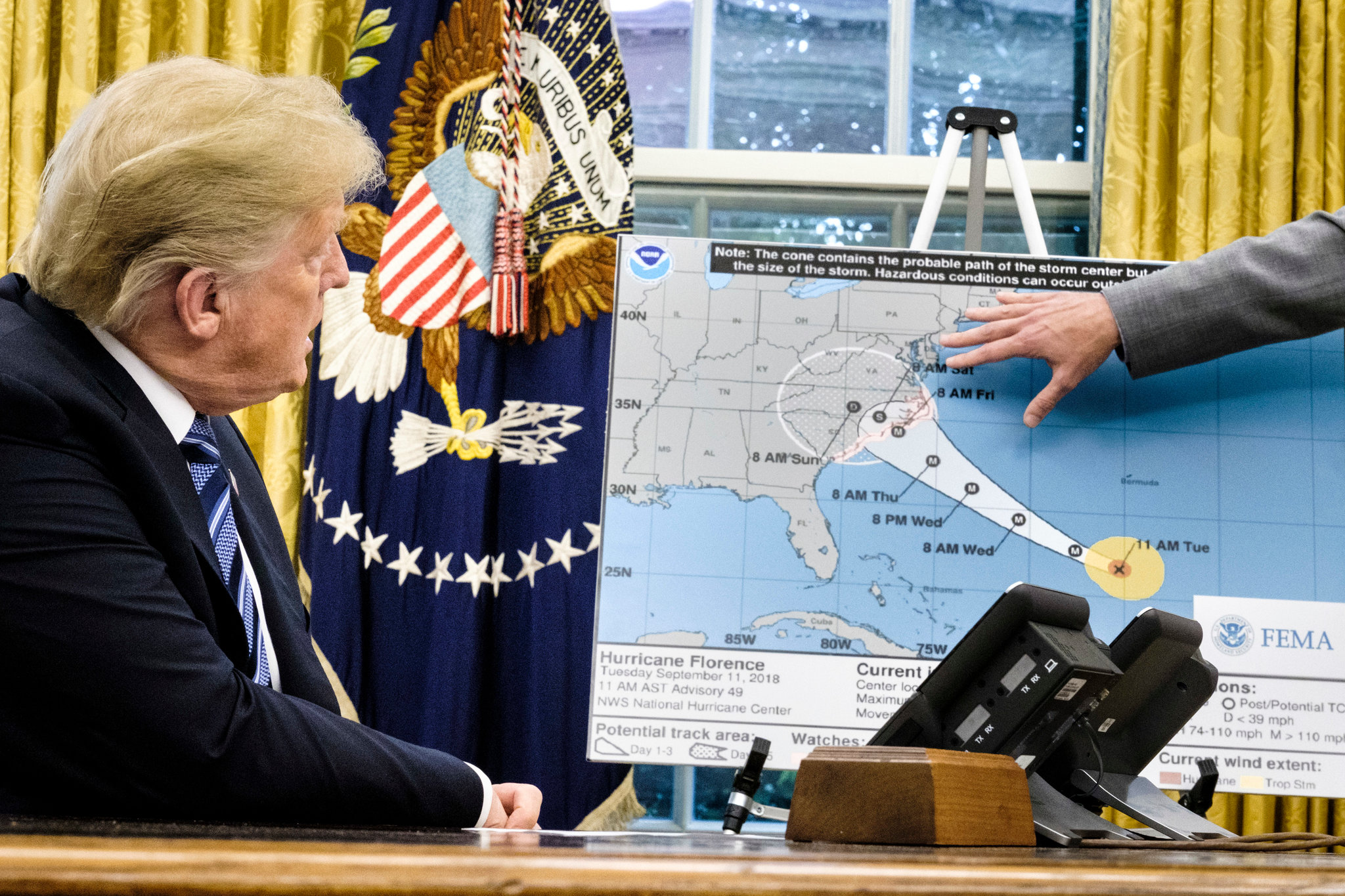 Figure 1: President Trump receiving a briefing from FEMA regarding the projected path of Hurricane Florence