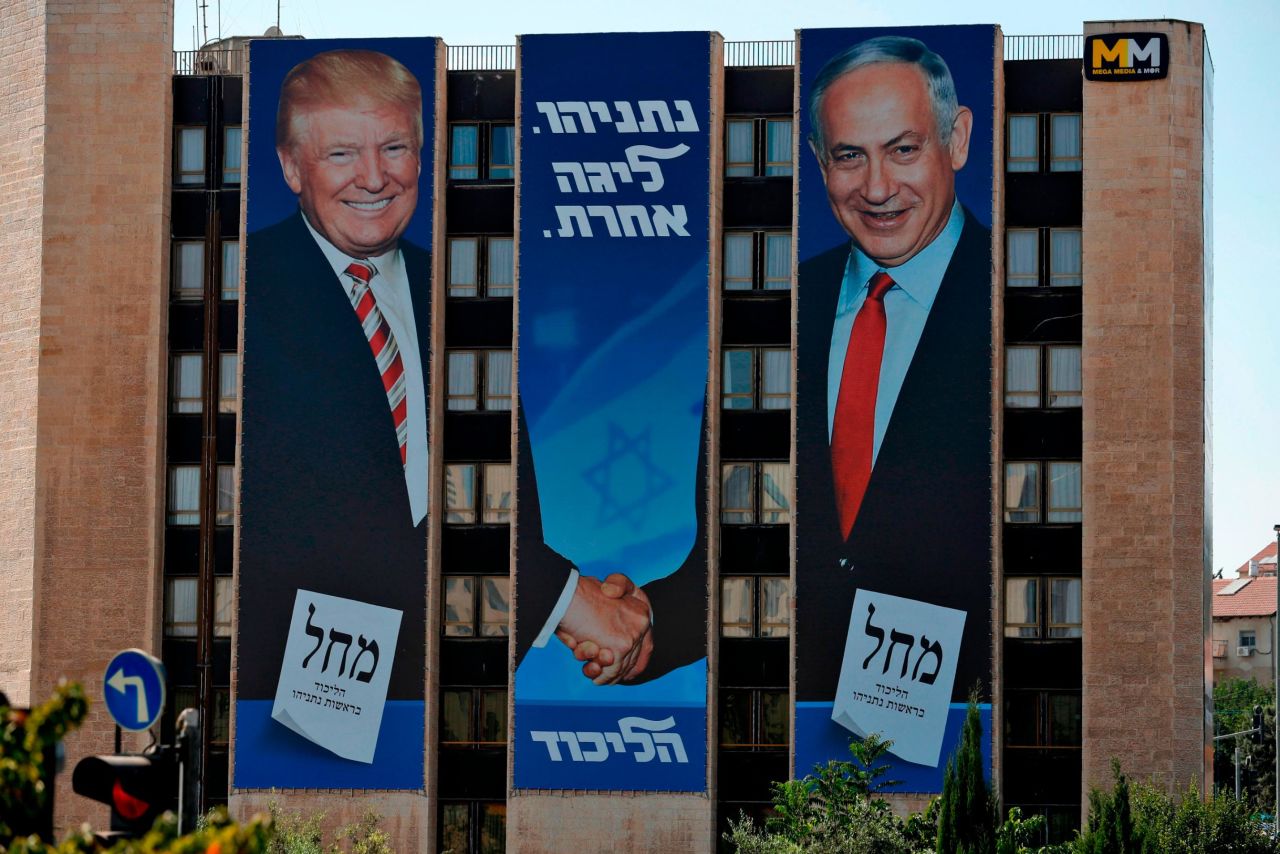 Billboard showing Trump and Bibi shaking hands